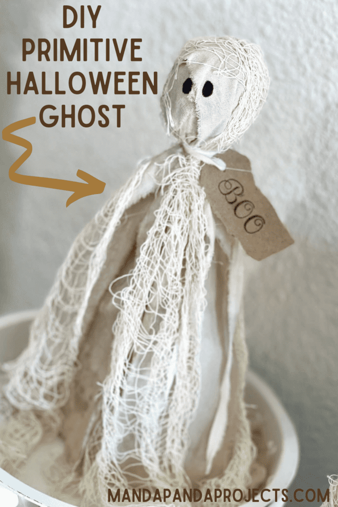 DIY Primitive Halloween Rag Ghost made with creepy cheese cloth and muslin that is stained with antique wax to look grungy with a hangtag around his neck that says "BOO".