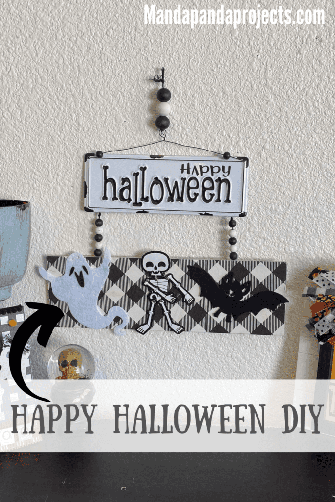 Happy Halloween Flossing skeleton DIY decoration with black and white metal sign and buffalo check along with a ghost, a bat, and a skeleton and wood bead hanger.