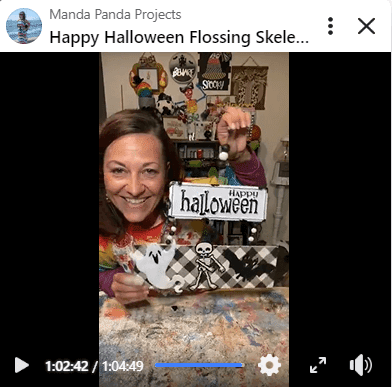 Amanda holding the completed project on a Facebook live thumbnail.