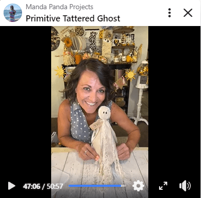 Amanda holding the completed project on a Facebook live thumbnail.