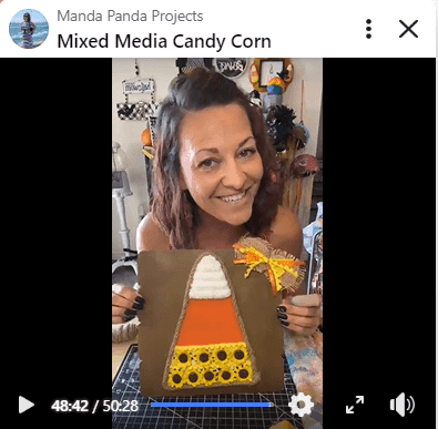 Amanda holding the completed project on a Facebook live thumbnail.