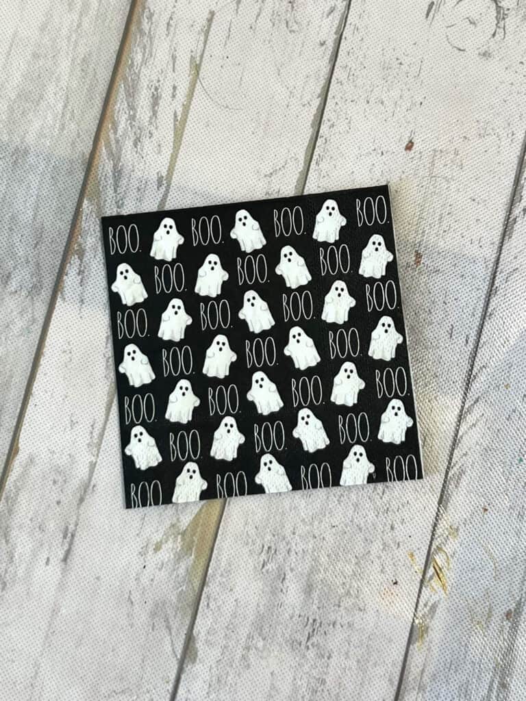 Rae Dunn BOO ghost napkin. Black napkin with white ghosts.
