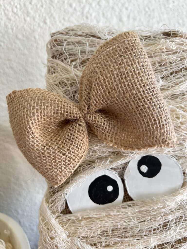 Simple burlap loop bow on the top of the Mummy girls "head".