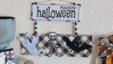 Happy Halloween Flossing skeleton DIY decoration with black and white metal sign and buffalo check along with a ghost, a bat, and a skeleton and wood bead hanger.