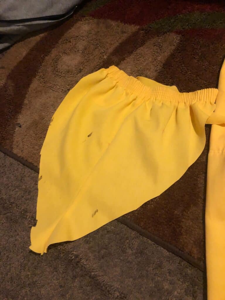 A big chunk of the yellow pants cut out to make them smaller.