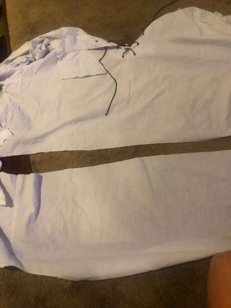 The white oversized collared shirt cut in half to make it smaller and not as long.