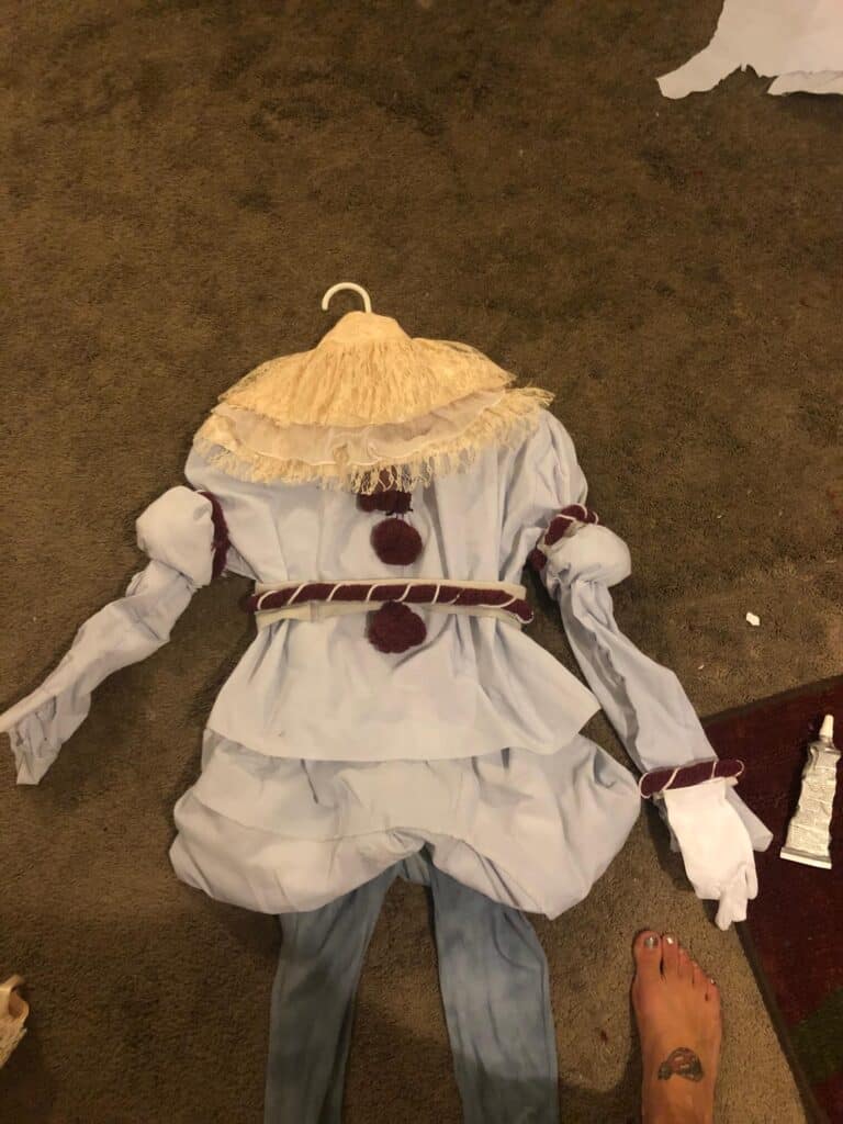 The completed new version of the handmade DIY Pennywise the clown halloween costume with the grey pants, and the white lace collar.
