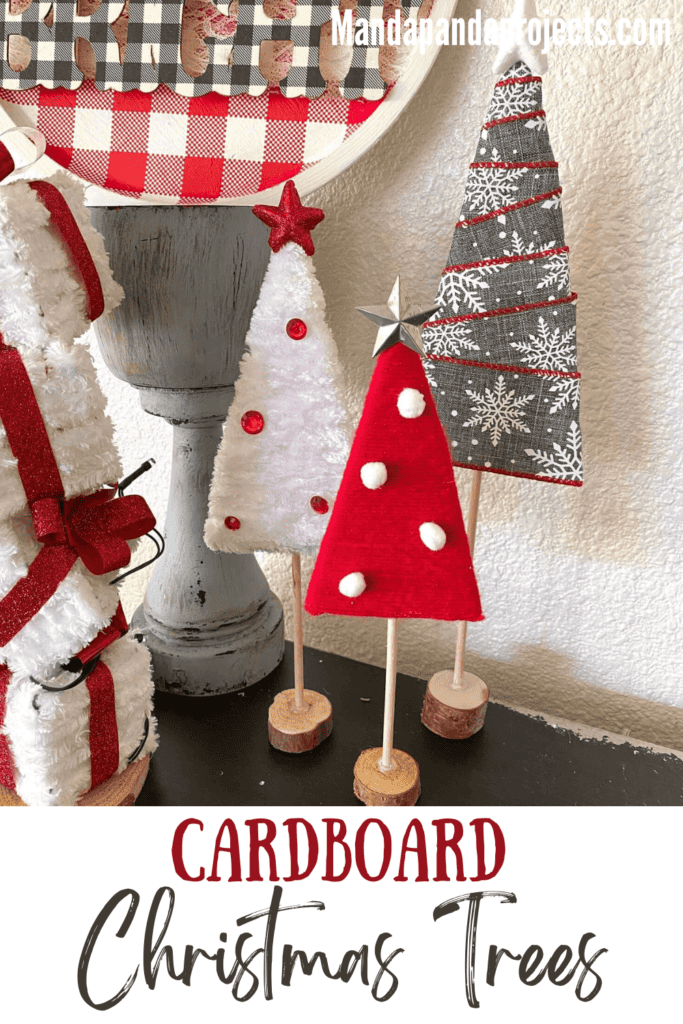 Red, white, and grey yarn and ribbon wrapped cardboard Christmas trees with star toppers and a wood dowel trunk with wood round base. Easy, affordable, DIY Christmas decor made with recycled material.