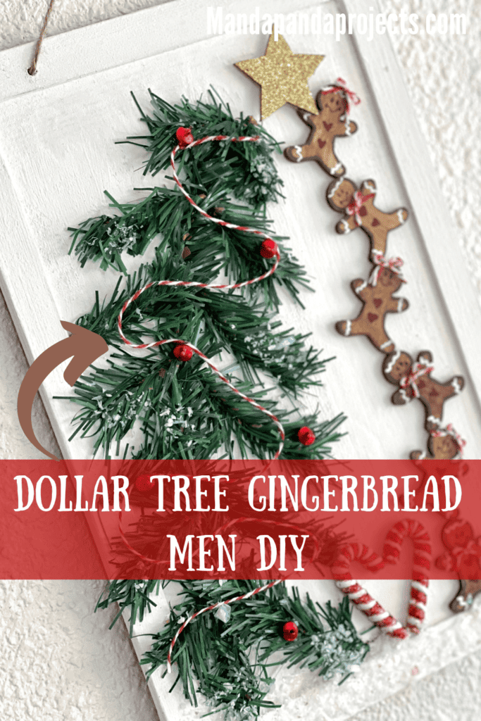 Dollar Tree Gingerbread Men DIY wall hanging decor made with mini gingies stacked on top of each other helping to put the gold star on top of the Christmas Tree made with wired faux pine, red bells, and bakers twine garland and faux snow underneath with a 2 candy canes in the shape of a heart.