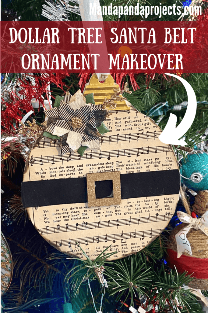 Dollar Tree Santa Belt Christmas Tree Ornament makeover with neutral style Music sheet paper, a black santa belt with gold buckle, green and black buffalo check poinsettia flower, gold glitter branches and a white ribbon hanger for DIY handmade ornaments.