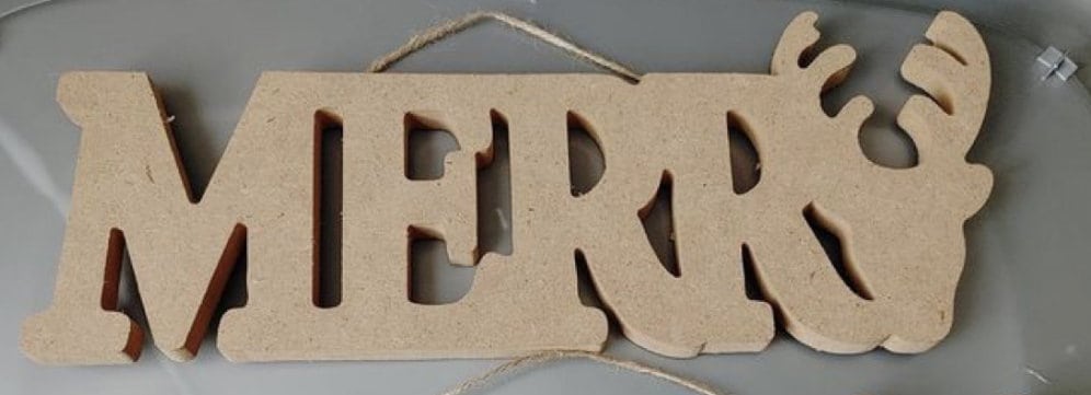 Dollar Tree wooden word Merry with a reindeer at the end.