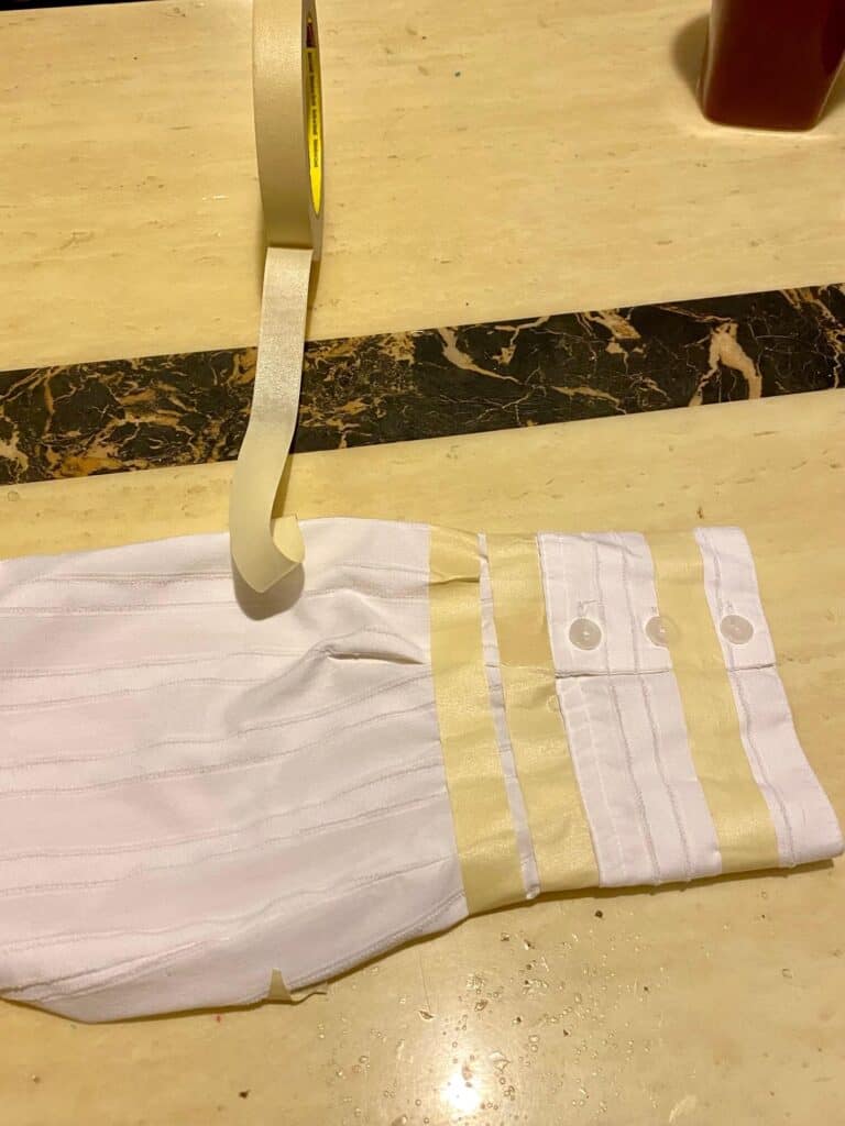 White shirt with masking tape used to tape off stripes.