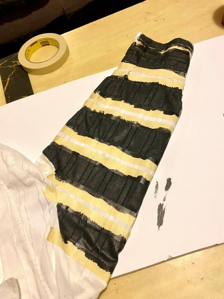 Black stripes painted on a white shirt to make the Black and White Beetlejuice suit for the handmade Halloween costume.