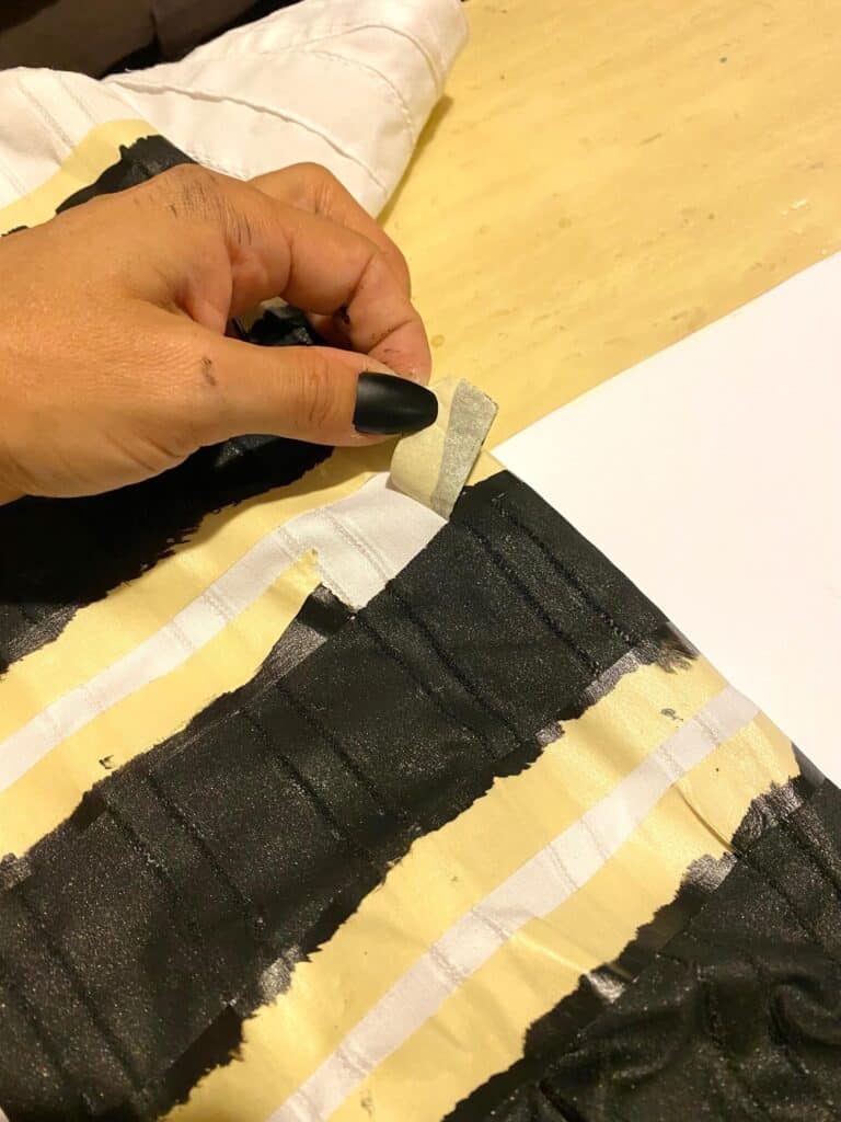Peeling off the masking tape to make nice clean black stripes for the Beetlejuice handmade costume.
