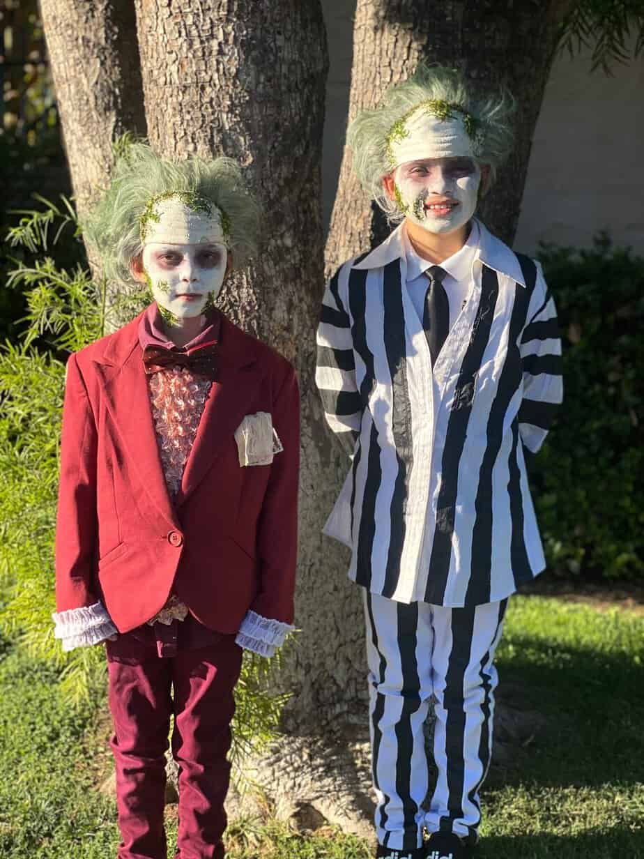 Handmade DIY Beetlejuice and Lydia Halloween Costumes from thrift store clothes. The Black and White suit and the Maroon Wedding suit.