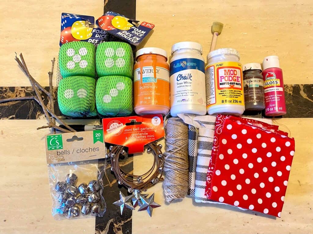 Supplies needed to make a winter snowman with dollar tree foam dice.