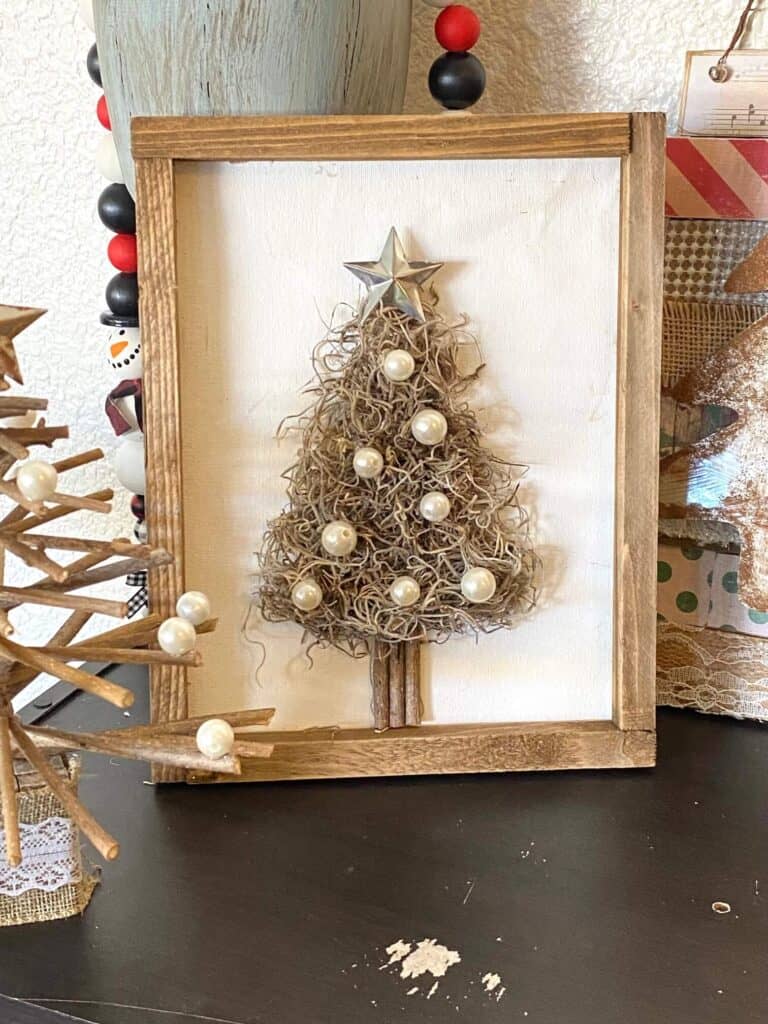 Spanish Moss Christmas Tree made with a Dollar Tree reverse canvas with pearl bead ornaments and a galvanized metal star topper.