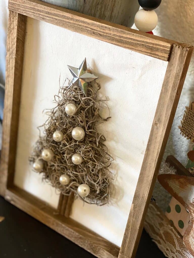 Spanish Moss Christmas Tree made with a Dollar Tree reverse canvas with pearl bead ornaments and a galvanized metal star topper.