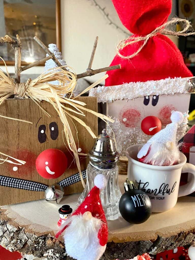 Top tier of the wooden tiered tray with the wood block santa and reindeer, mini gnomes, and mini mug.