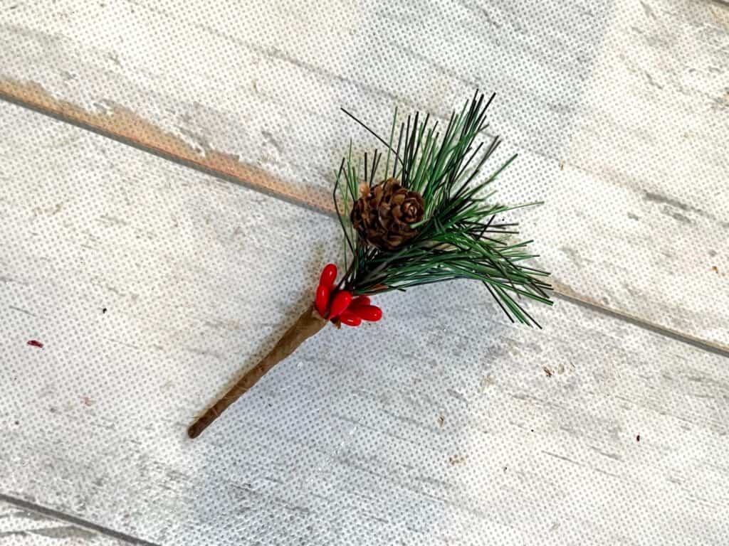 Small faux pine pick with mini pine cone and red berries.