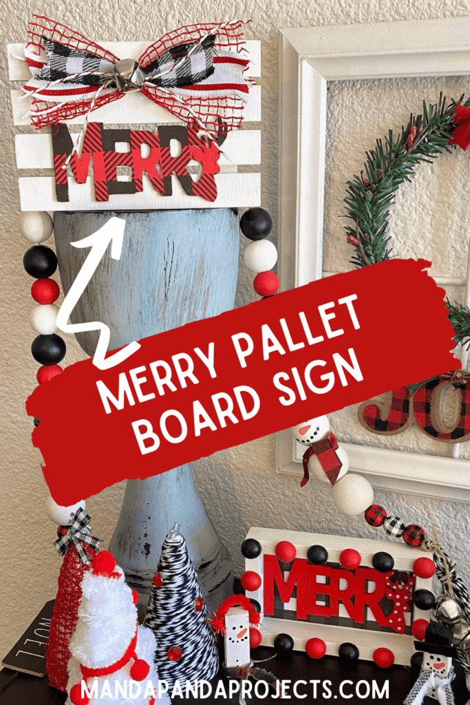 Tiered Tray Merry Pallet Board with a red and black buffalo check word Merry and a cute bow and silver bell to decorate  for christmas.
