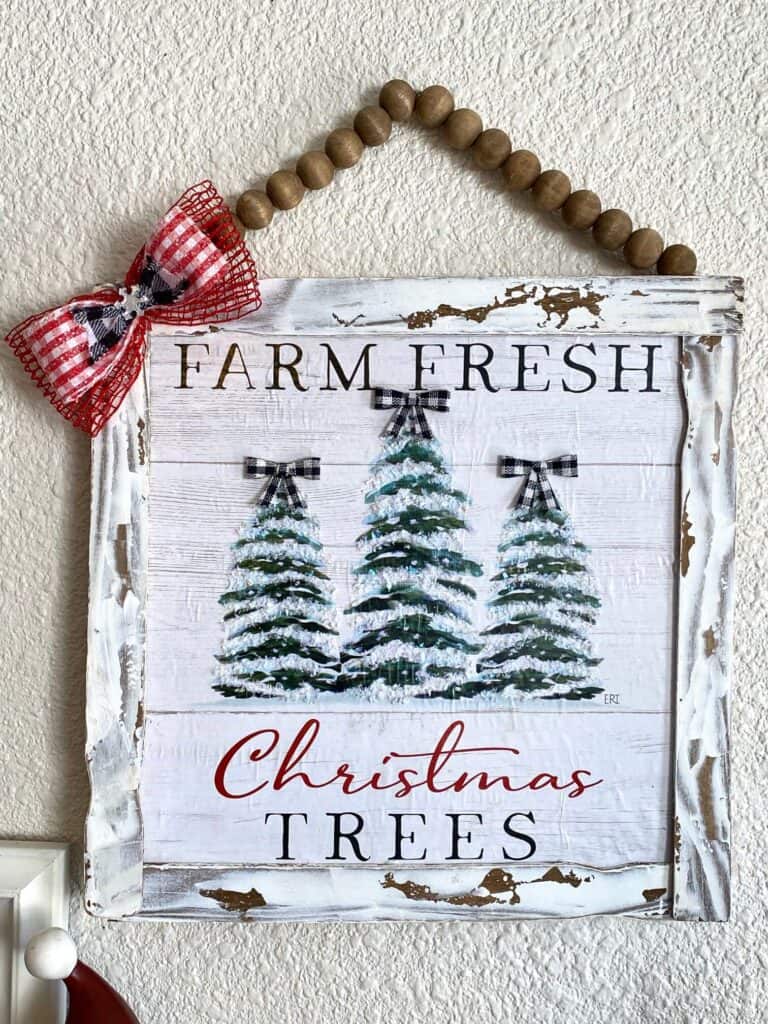 Dollar Tree Calendar December print Farm Fresh Christmas Trees sign made with paint stick frame and a wood bead hanger.
