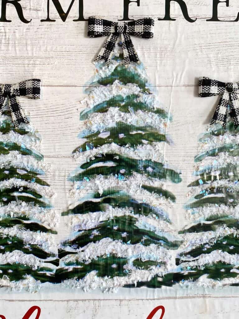 Close up of the Christmas Trees on the print with faux snow Mod Podged to the branches.