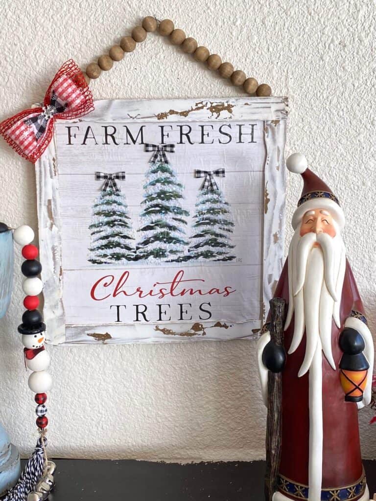 Dollar Tree Calendar December print Farm Fresh Christmas Trees sign made with paint stick frame and a wood bead hanger.