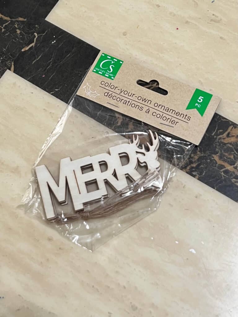 A package of the Dollar Tree Merry word cutouts.