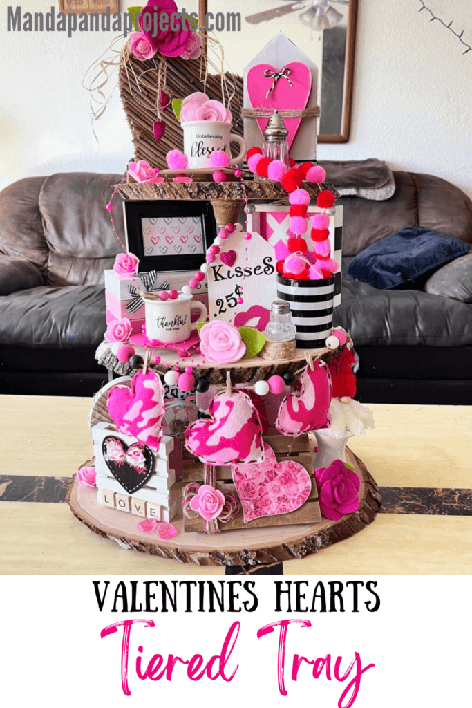 Rustic Valentines Day Tiered Tray Inspo on a handmade tray with pinks, reds, hearts, and packed with Valentines themed tiered tray miniatures and decor on all 3 tiers made of wood rounds.