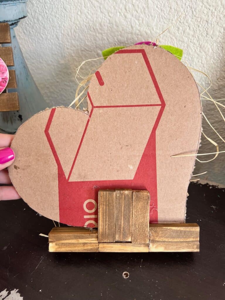 The back of the project showing the heart shape cut out of cardboard.