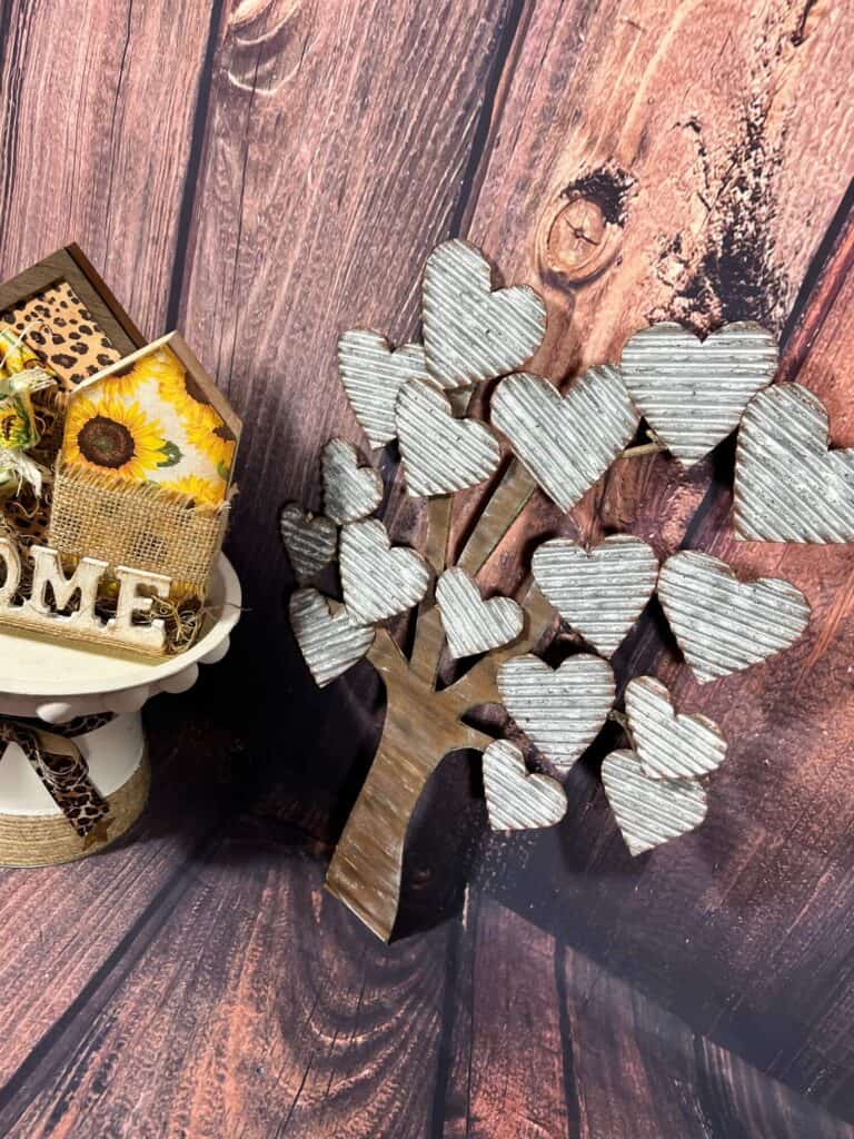 Faux Galvanized Metal Heart Tree decor made on a budget with cardboard as a copycat of Hobby Lobby decor. Corrugated cardboard painted silver with faux rust edges to look like metal.