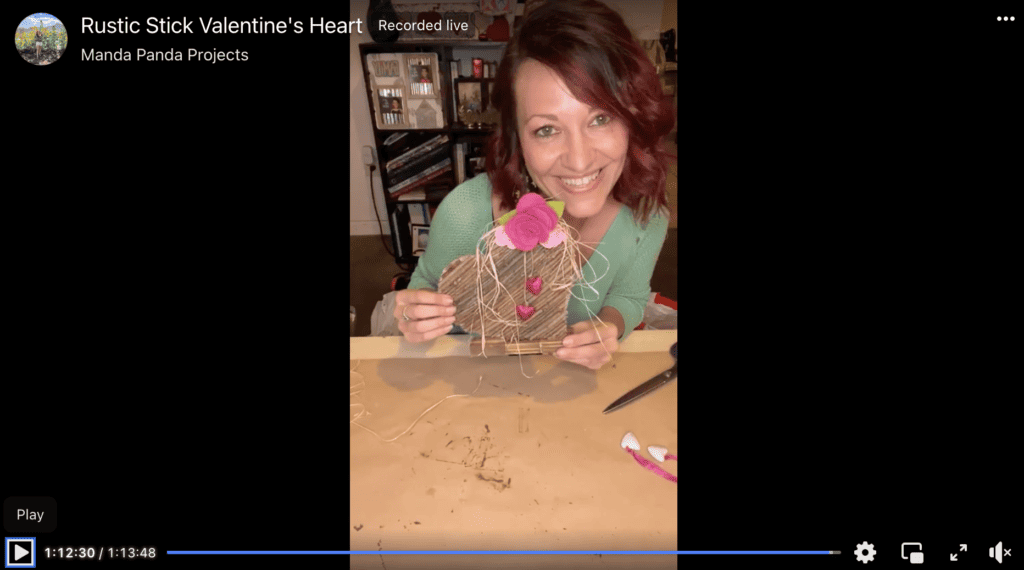 Amanda holding the completed project on a Facebook live.