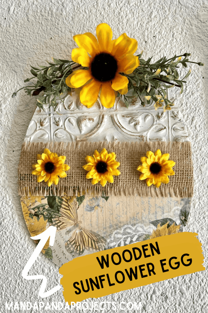 Makeover a wooden Dollar Tree Easter Egg with an unlikely theme. Sunflowers! This unique and affordable DIY Easter decor is made with a rice paper printable, and the best part is it can be made on a budget!