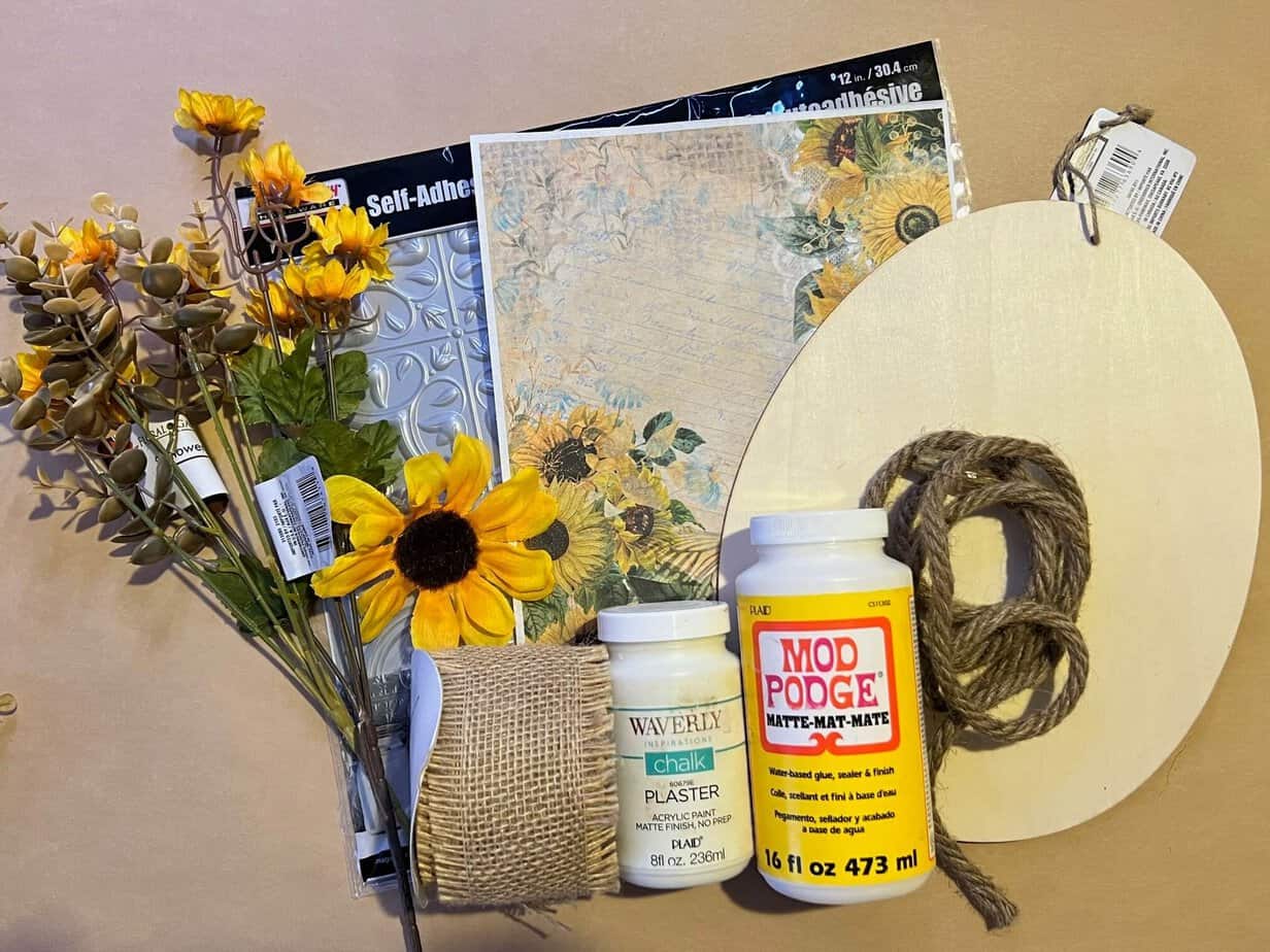 Supplies needed to make a wood easter egg with a printable and a wall tile.