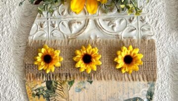 Dollar Tree Sunflower wood Easter Egg made with a rice paper printable, a Dollar Tree wall tile, burlap, sunflowers and greenery for DIY easter decor.