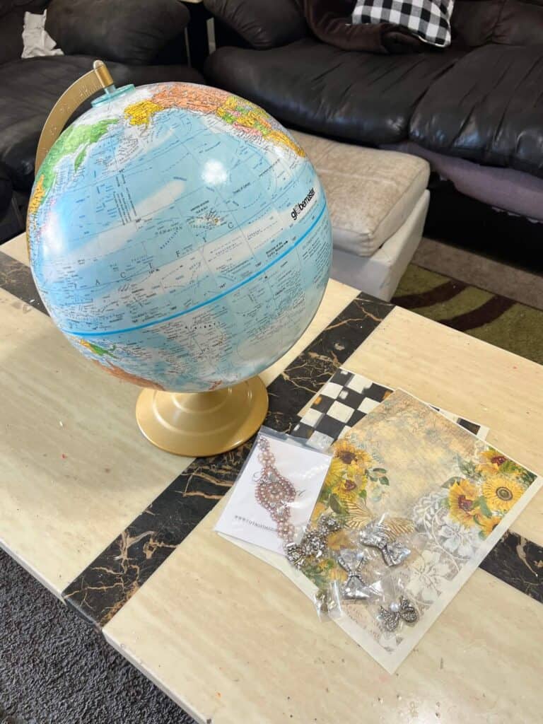 A thrift store globe, totally dazzled bling, and 2 pieces of rice paper.
