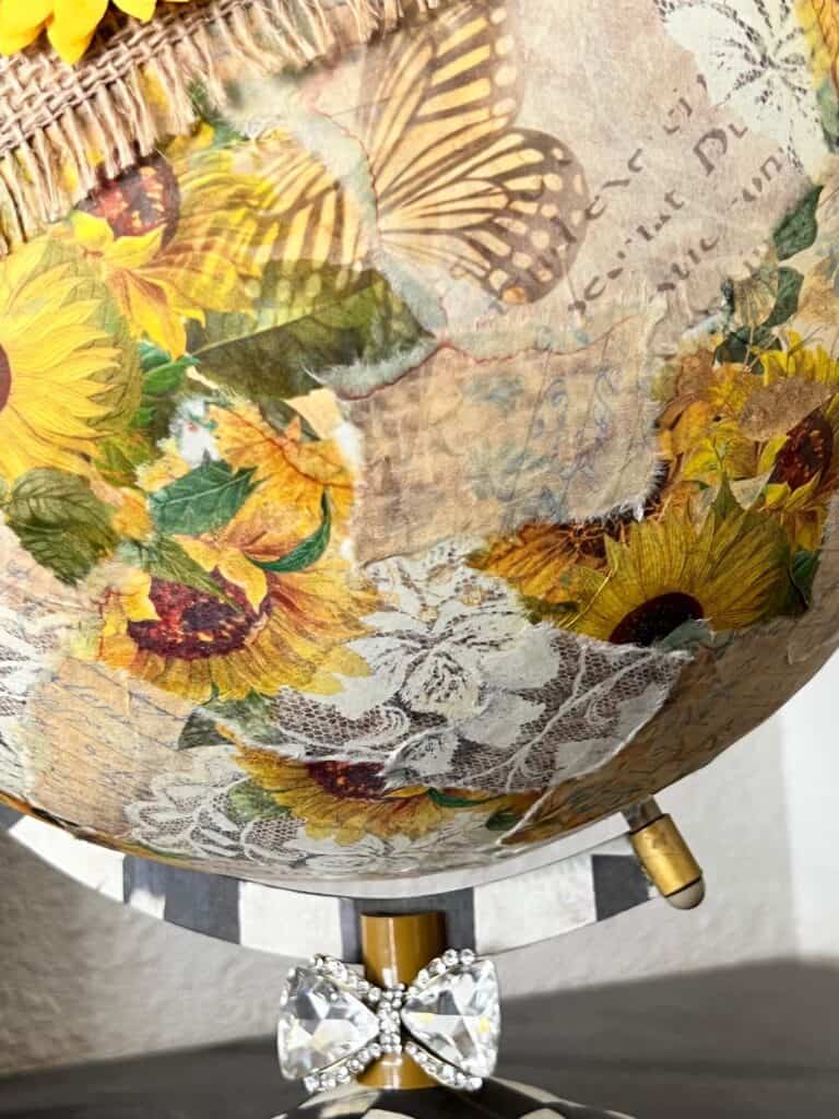 Close up of the sunflower rice paper decoupaged to the globe.
