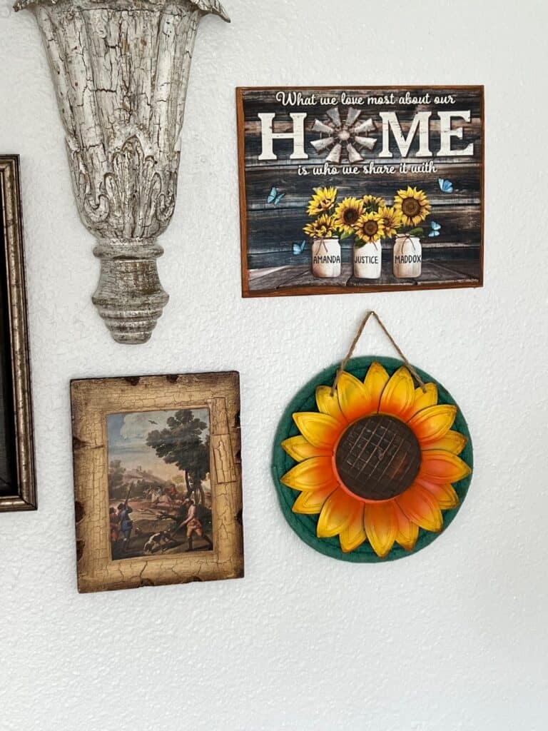 Another crackle frame, a metal sunflower, and a canvas that says "Home" with 3 sunflower vases and the names "Amanda", "Justice", and "Maddox" written on them.