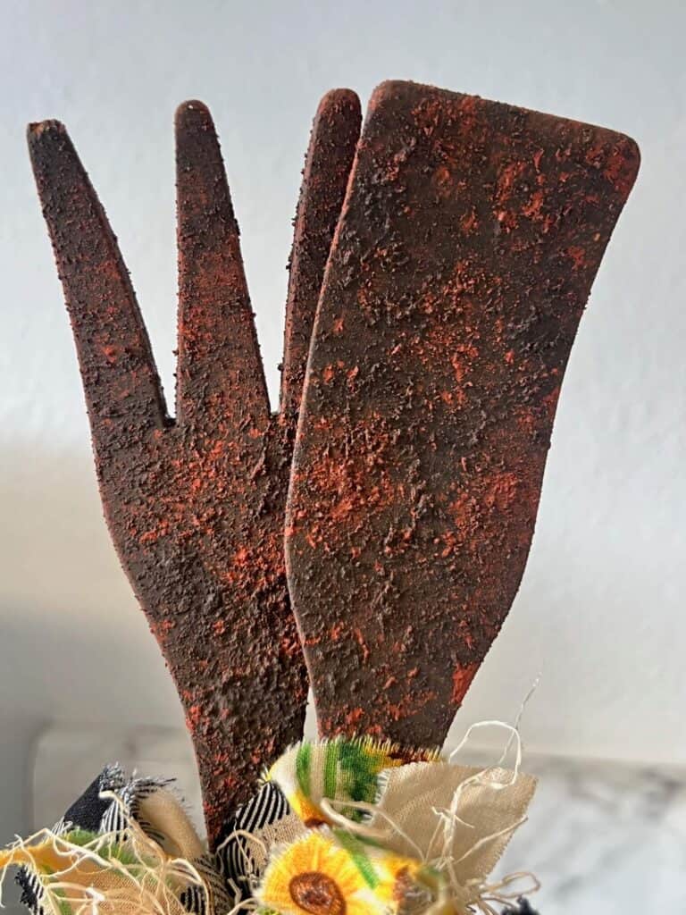 Close up of the wood utensils after being rusted with the rust effect paste.