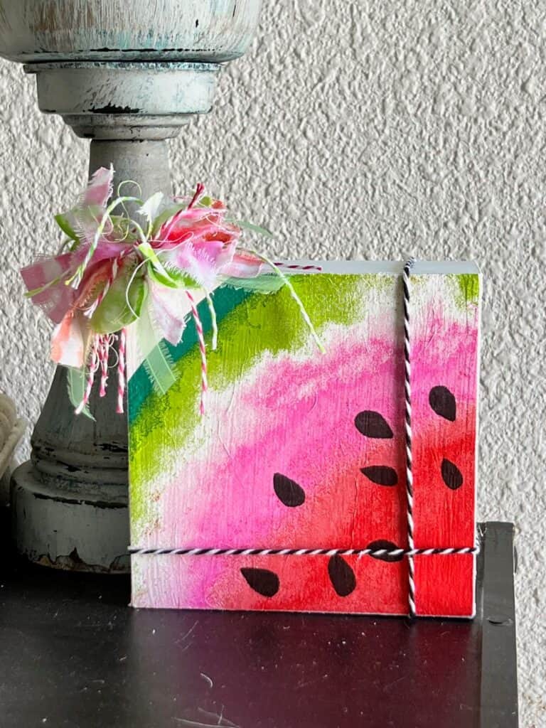 Dollar Tree Watermelon napkin shelf sitter with scrap bow.