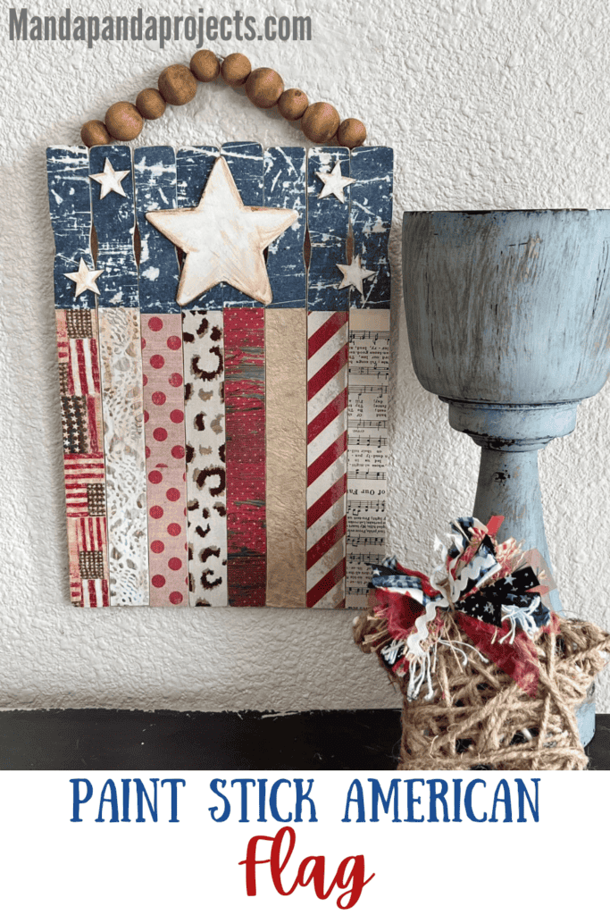 Paint Stick American Flag DIY Patriotic decor for decorating for 4th of July and showing American pride with red and white striped paint sticks with blue and white stars and a wood bead hanger.