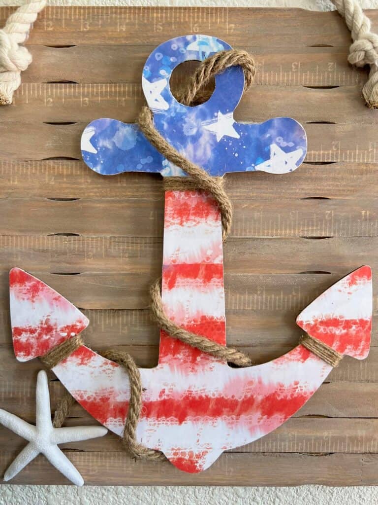 Wood Dollar Tree anchor with american flag scrapbook paper mod podged to it.