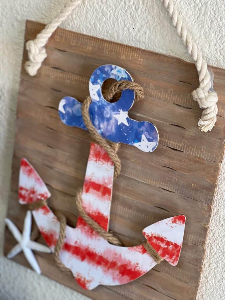 Wood anchor with american flag scrapbook paper mod podged to it.
