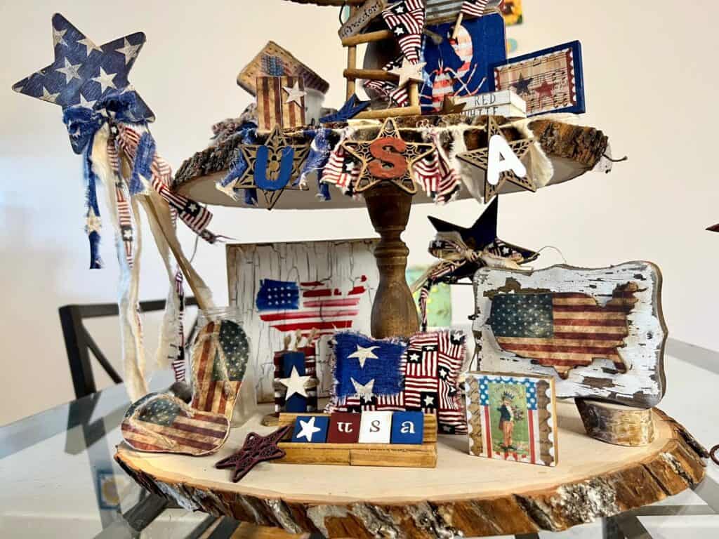 The same picture as above showing the bottom of the tiered tray but at an angle that shows the full Patriotic Star Wand on the left.