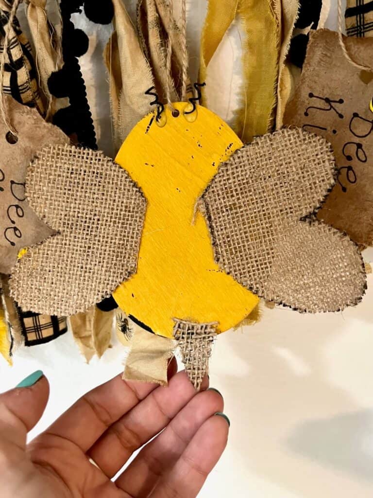 The back of the Easter egg bumblebee showing the wings glued on the back, and the stinger made of burlap.