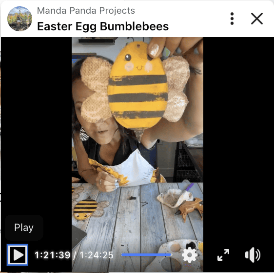 Amanda holding the easter egg bumblebee on a Facebook live thumbnail.