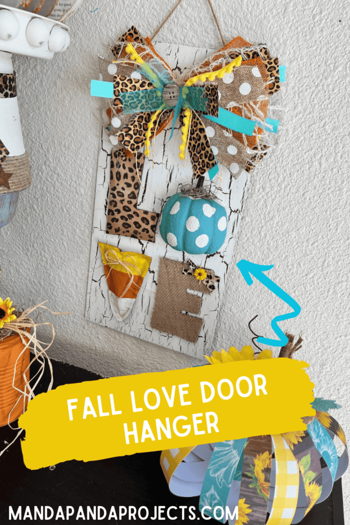 Fall in "LOVE" Door Hanger with the crackle paint white surface, leopard print L, teal polka dot pumpkin O, candy corn V, and burlap E, and big messy bow! DIY fall decor.