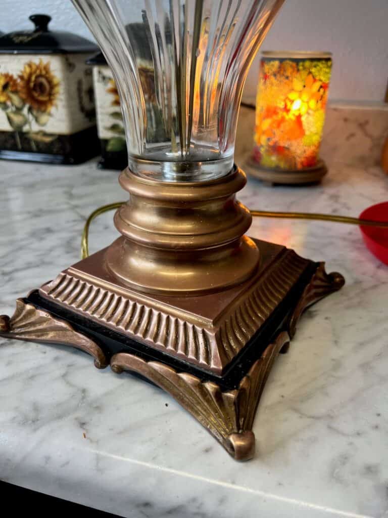 The bottom brass portion of the lamp completely restored back to its natural brass color.