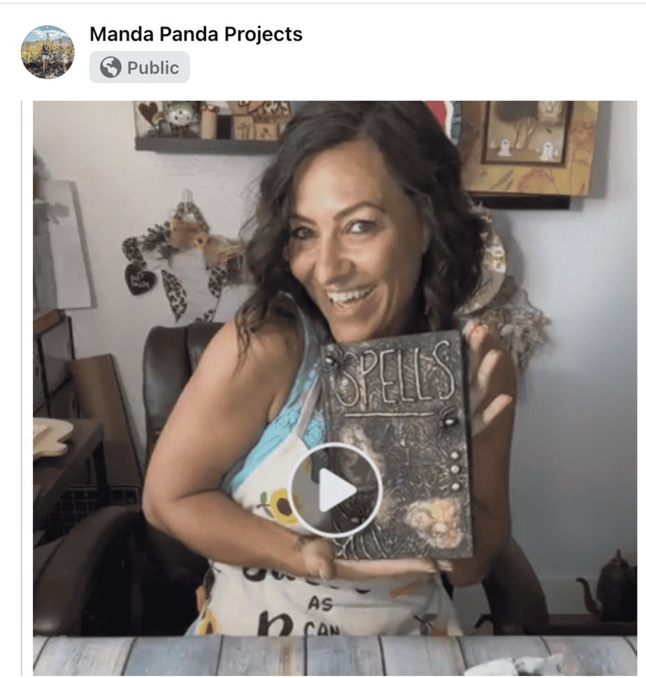 Amanda holding a completed craft on a FB Live Thumbnail